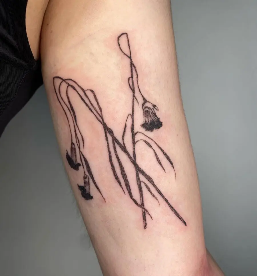 Elegant dead flower tattoo with fine lines