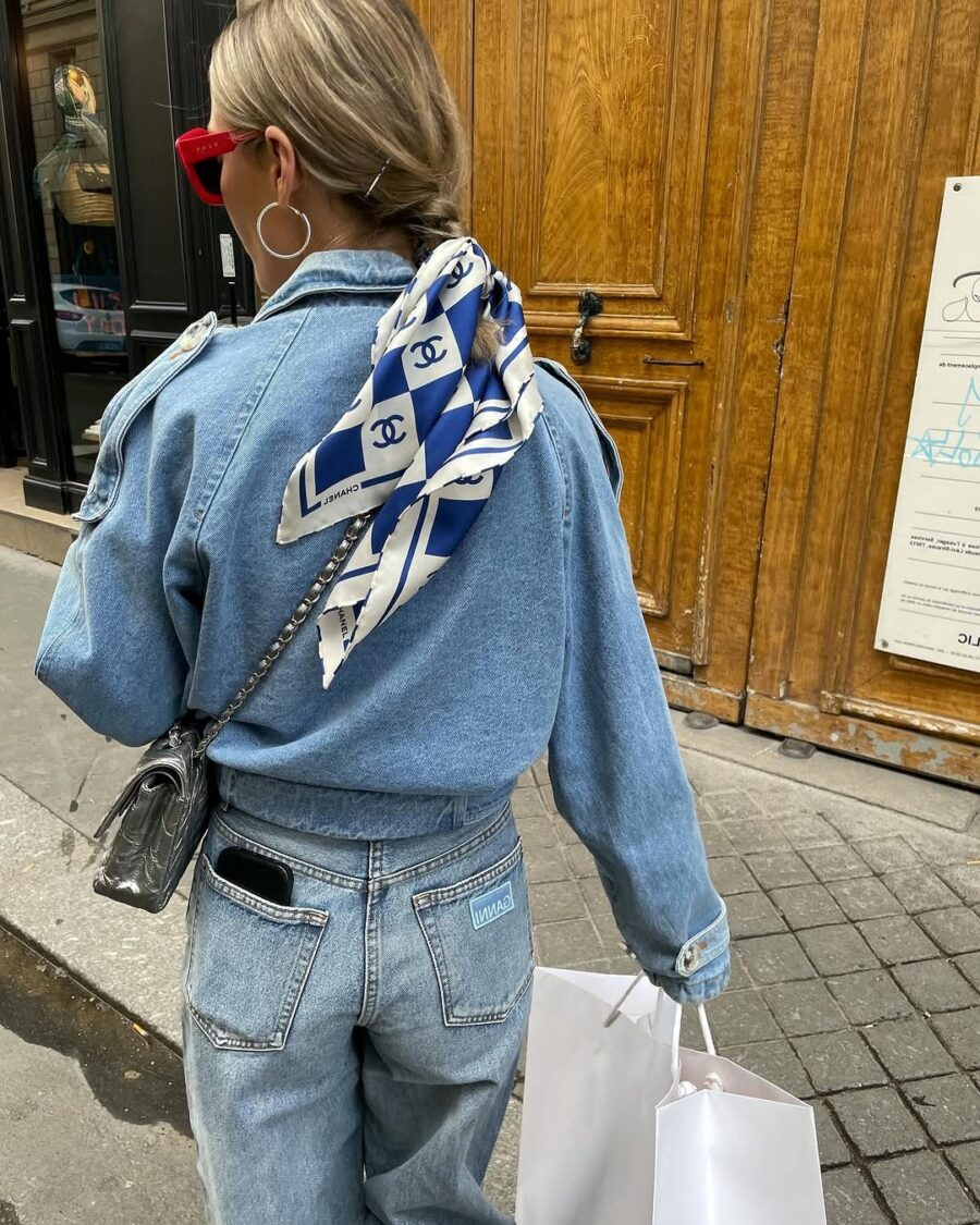 Chic denim jacket with a stylish scarf