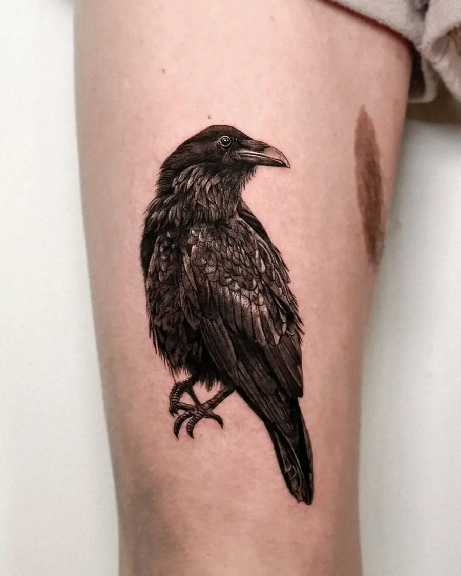 Realistic raven tattoo showcasing intricate details