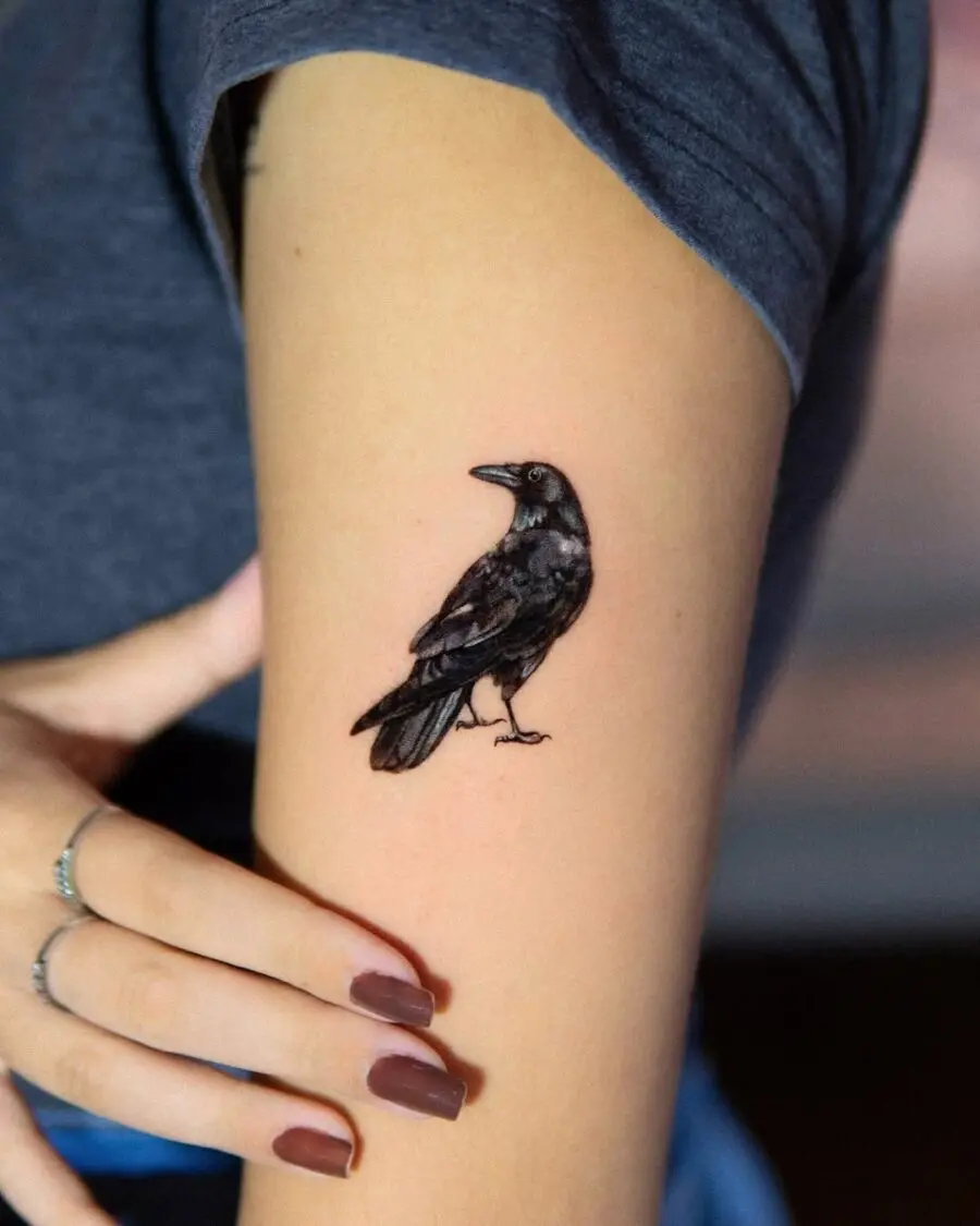 Elegant raven tattoo in striking black ink