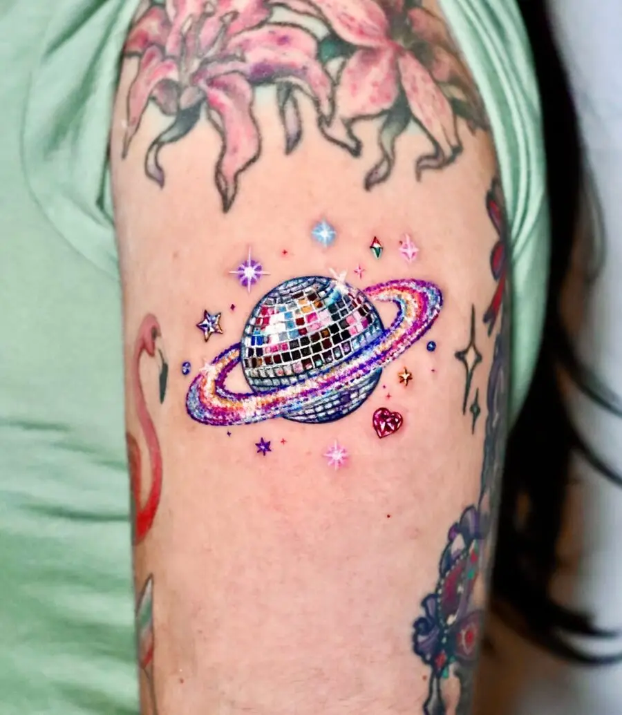 Unique disco-themed celestial arm tattoo design