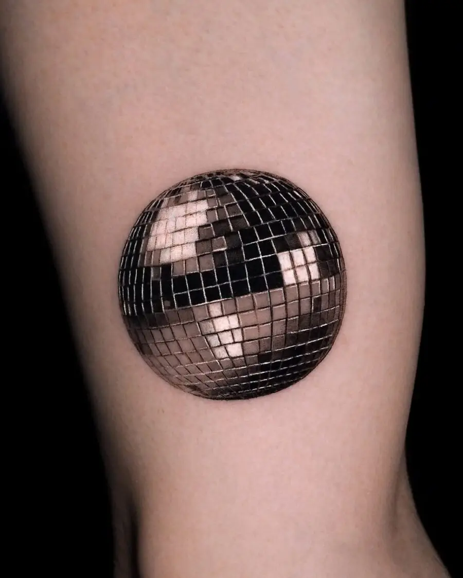 Stylish silver ink disco ball tattoo concept