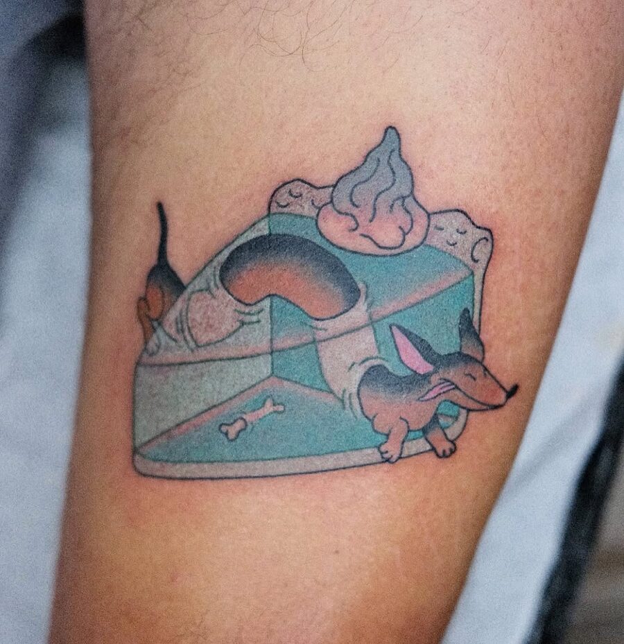 Whimsical pie tattoo with a playful dachshund