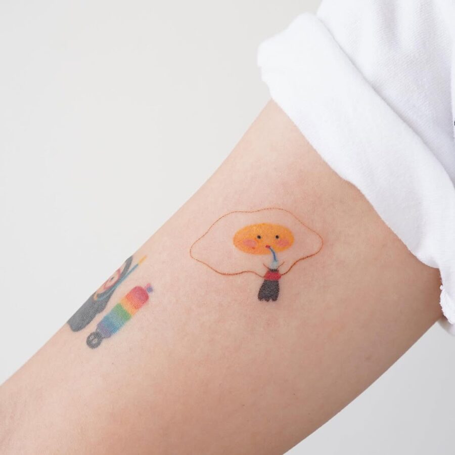 Charming cartoon egg character tattoo design