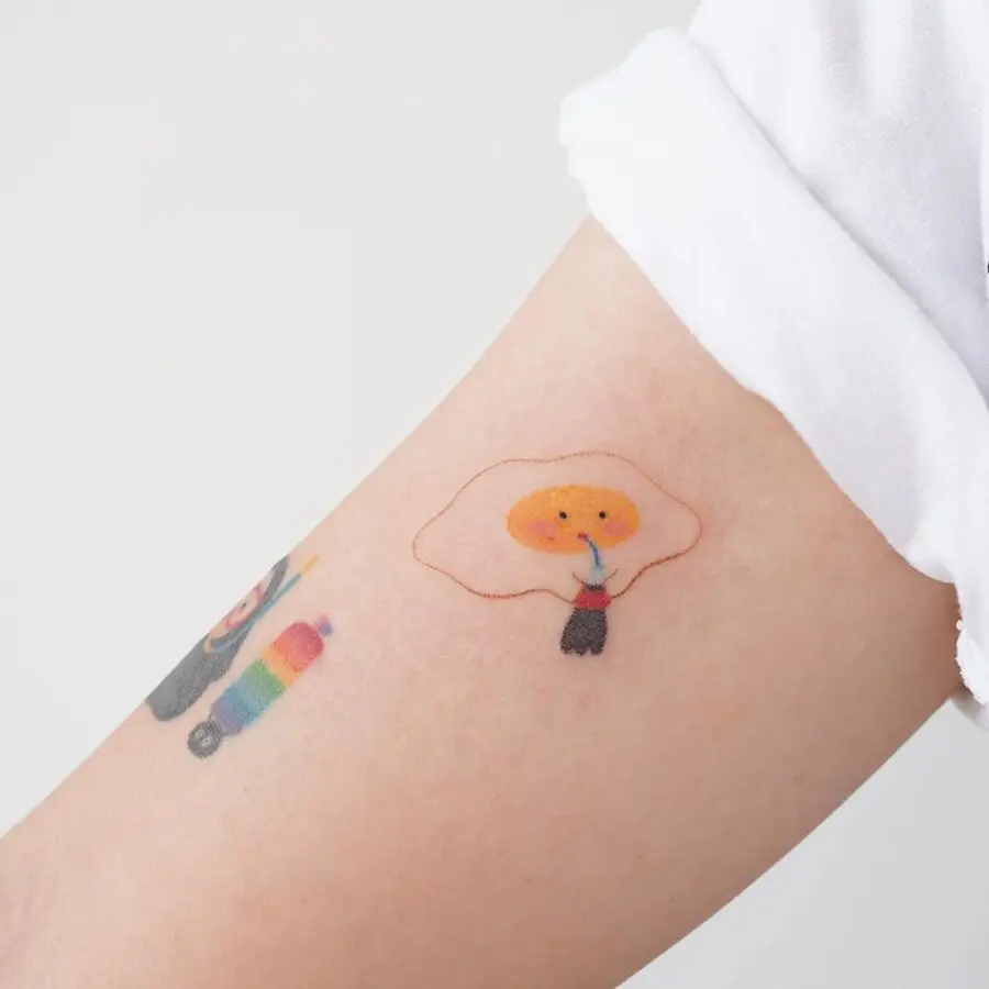 Charming cartoon egg character tattoo design