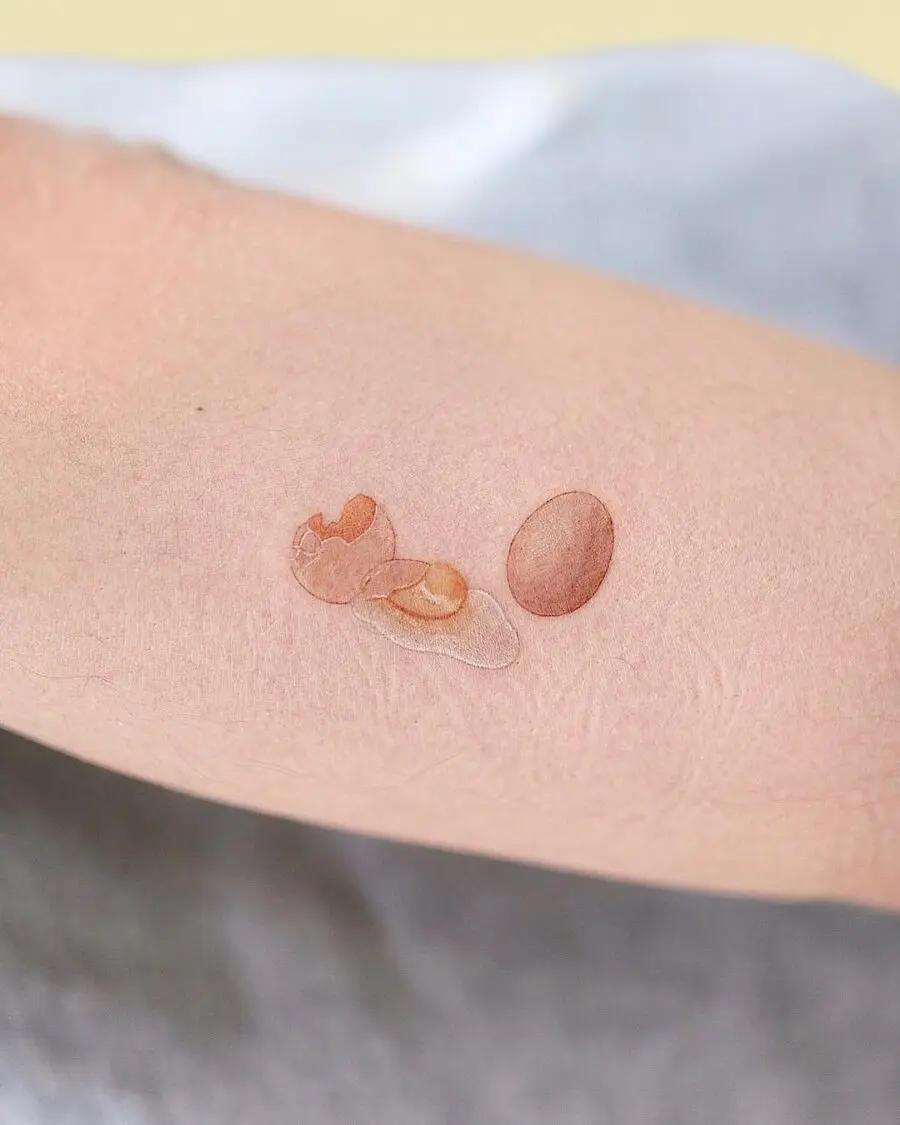 Realistic egg tattoo showcasing fresh elegance