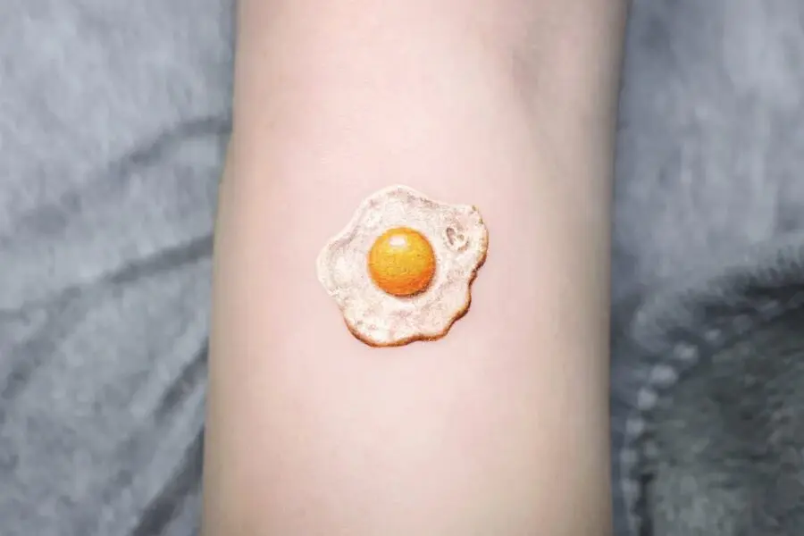 Realistic Fried Egg Tattoo on Skin