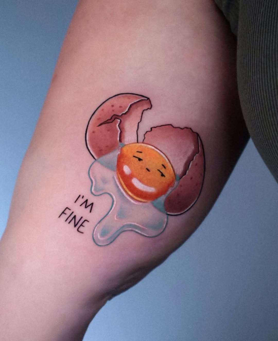 Whimsical egg tattoo with a cheerful vibe