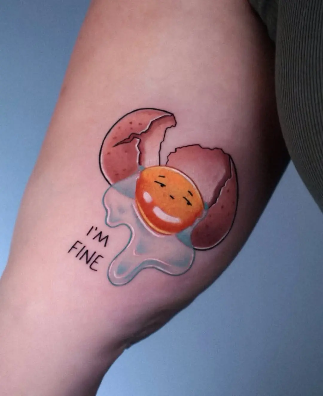 Whimsical egg tattoo with a cheerful vibe