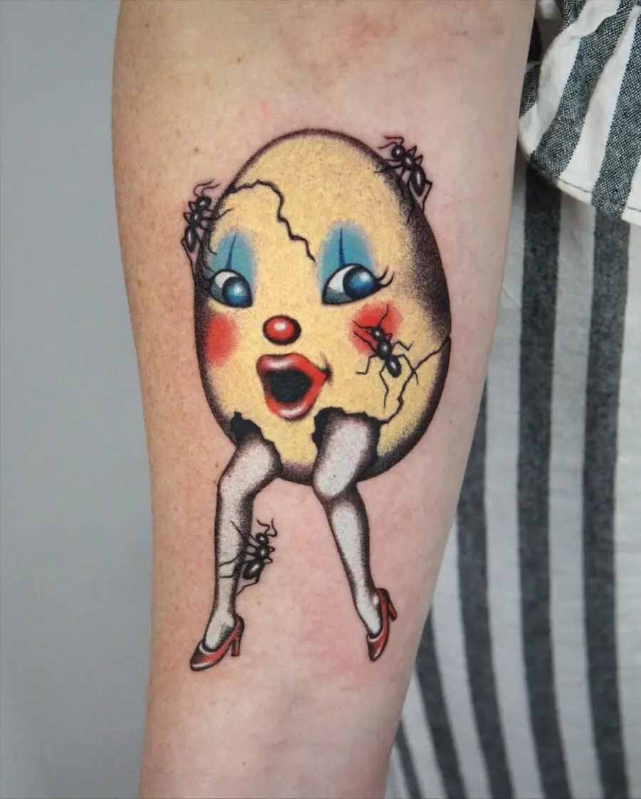 Whimsical egg tattoo featuring a playful character