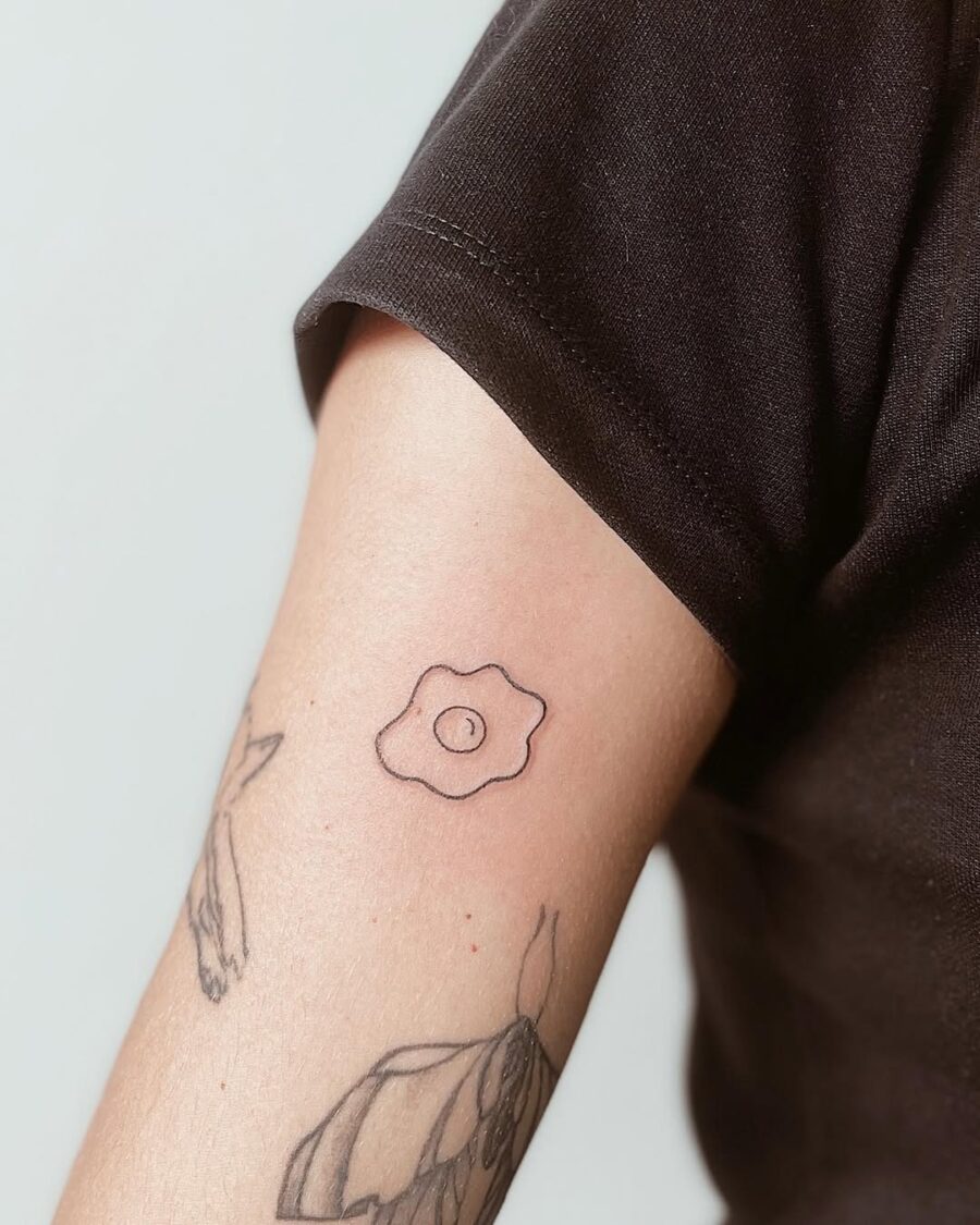Charming Minimalist Egg Tattoo on Arm