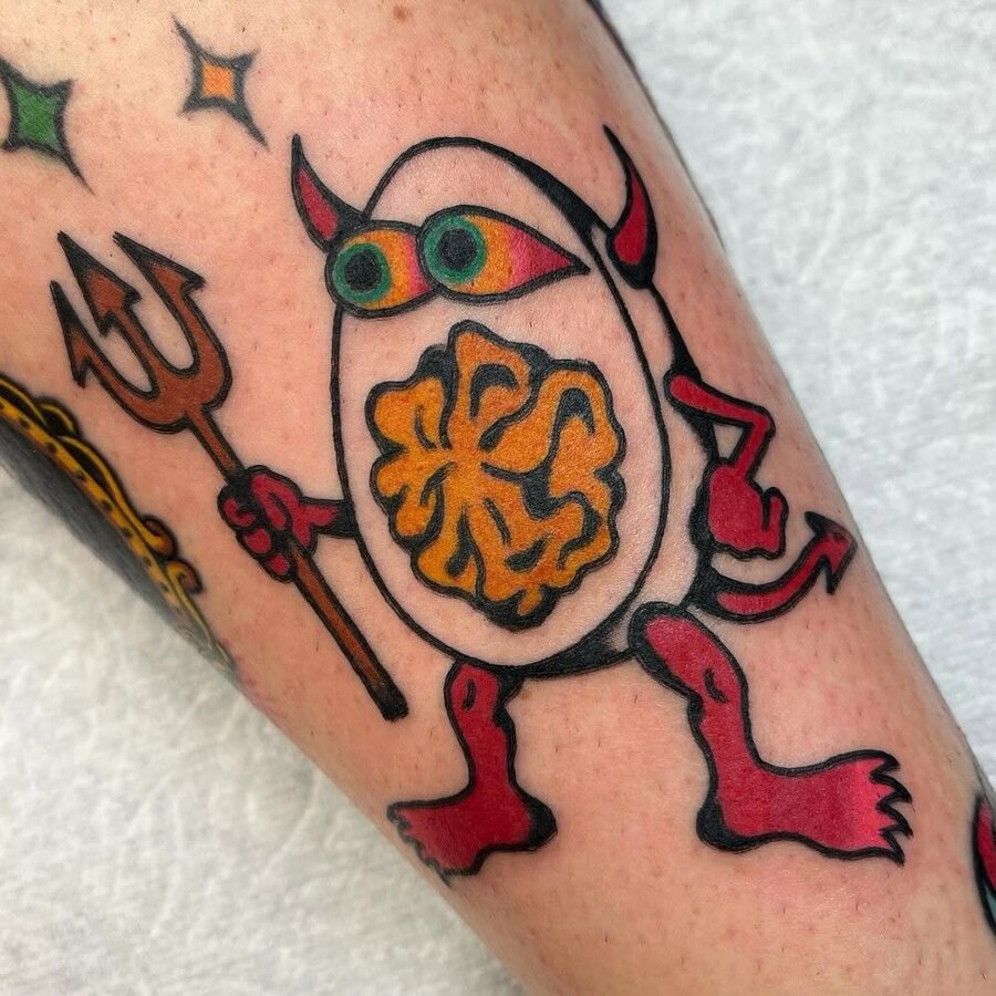 Whimsical egg tattoo with monster features
