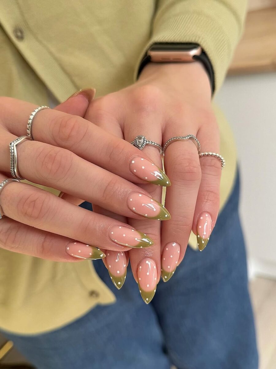 Chic green French tip nails with playful dots