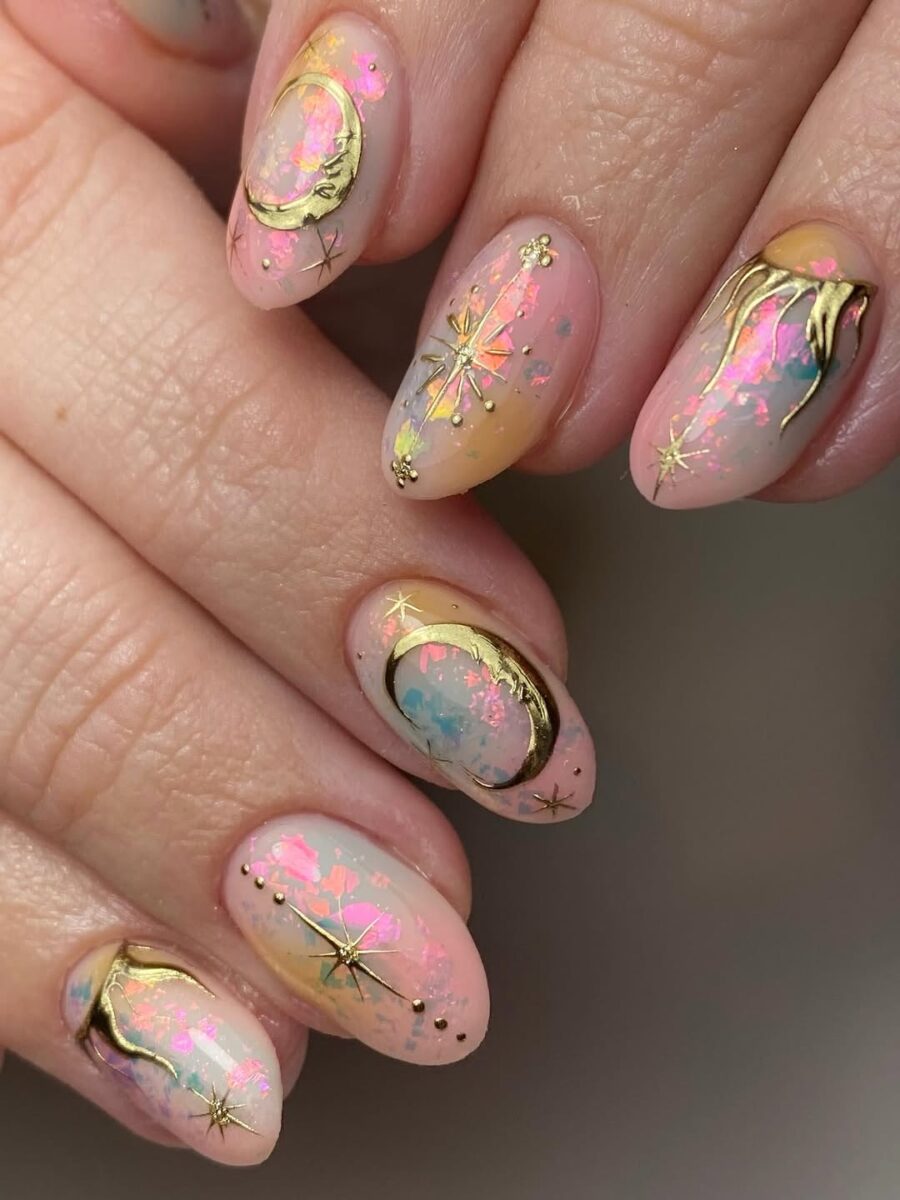 Whimsical pastel nails with celestial accents
