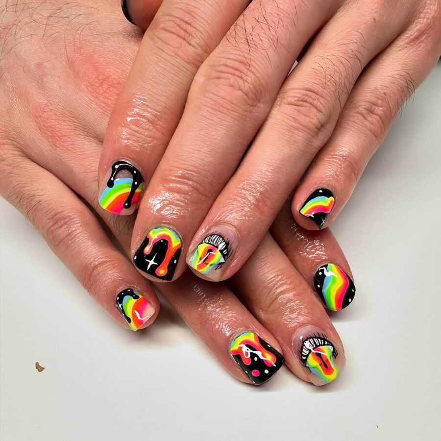 Vibrant rainbow festival nails on a black base