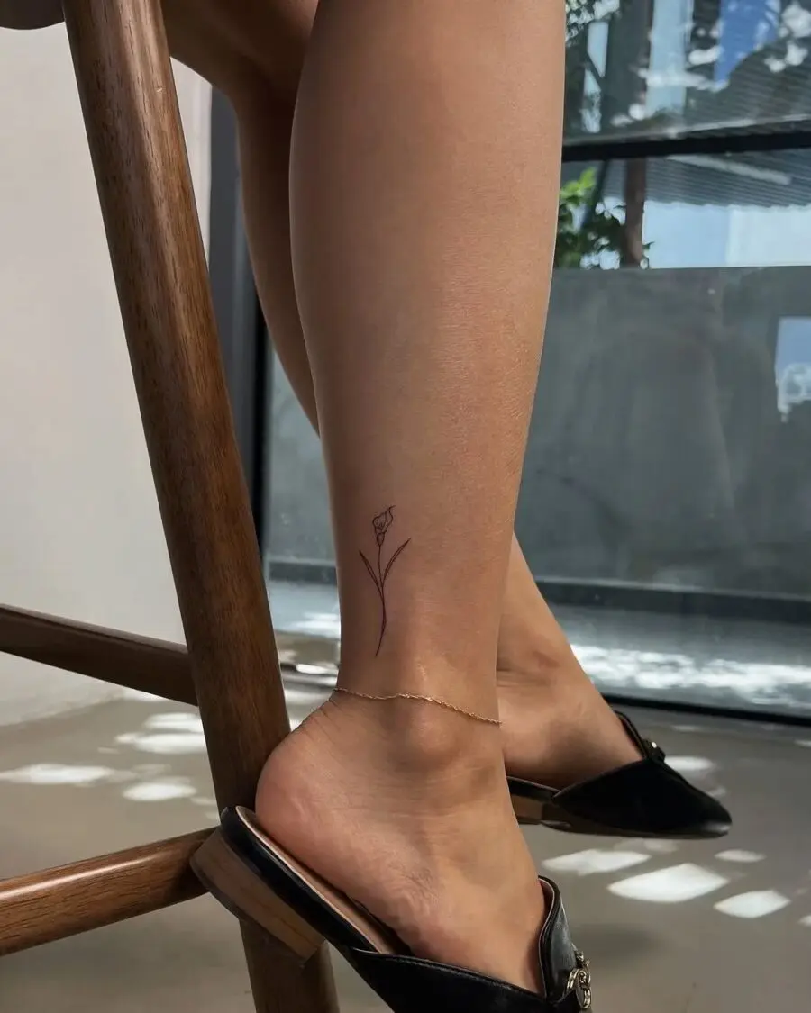 Chic minimalist flower ankle tattoo design