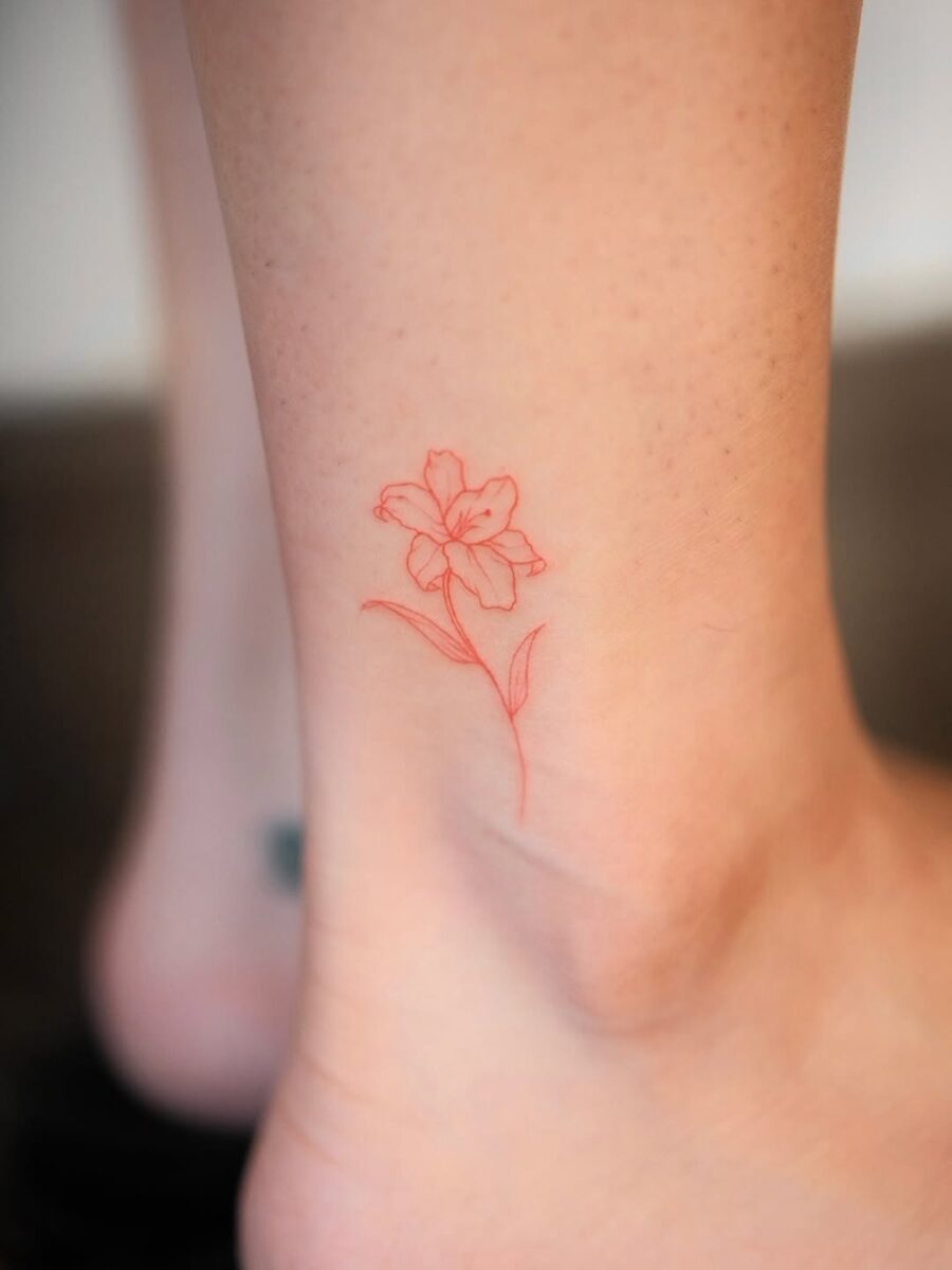 Delicate red flower ankle tattoo concept