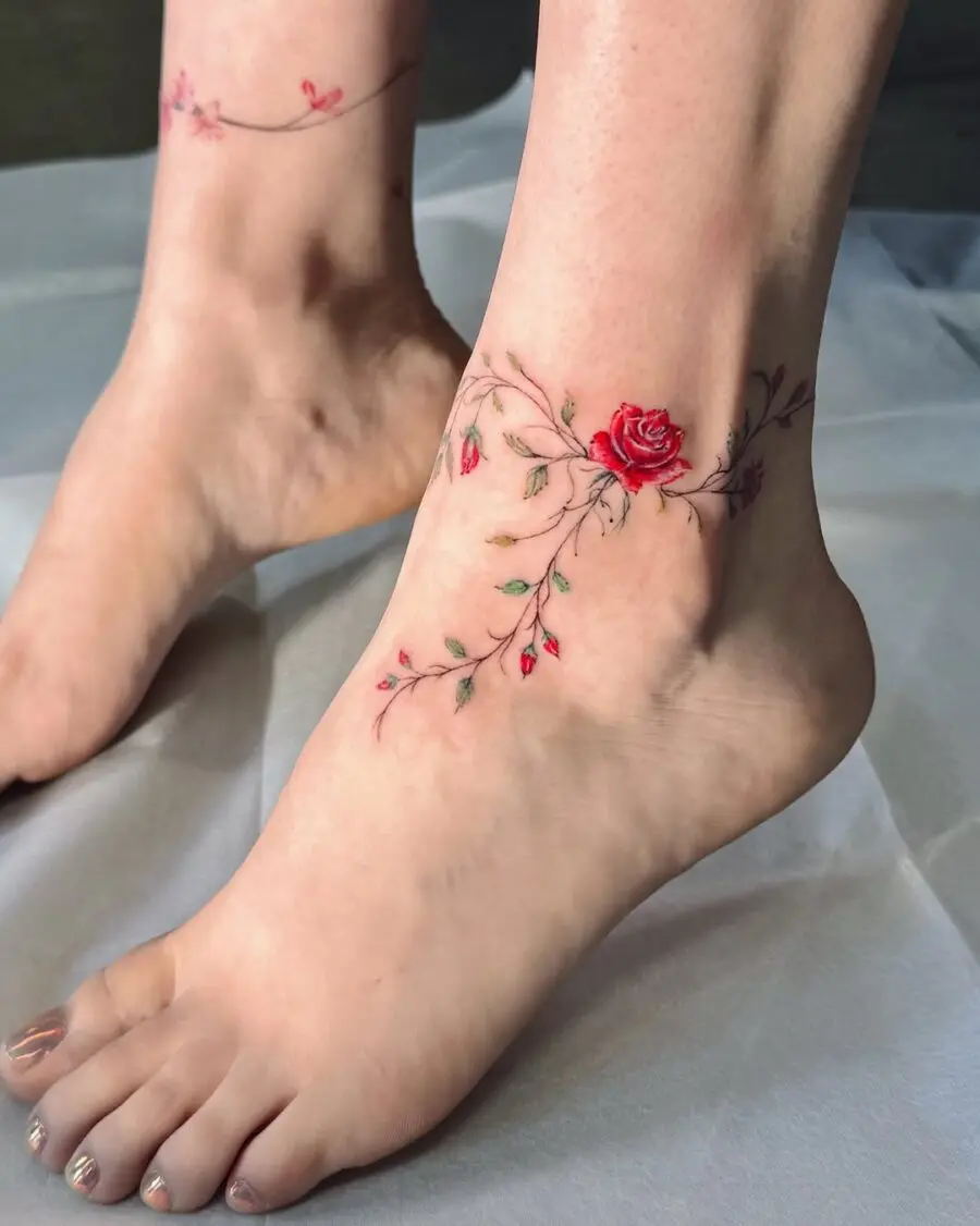 Elegant rose tattoo wraps around the ankle