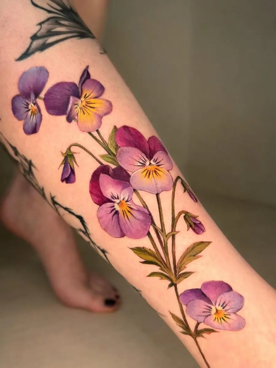 Stunning floral tattoo with elegant violets