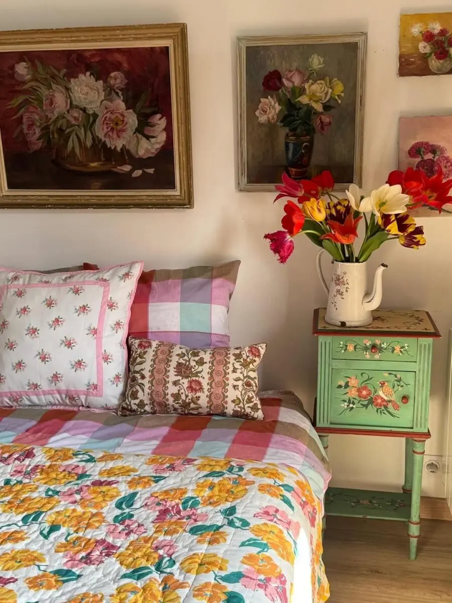 Charming floral bedroom with vibrant quilt