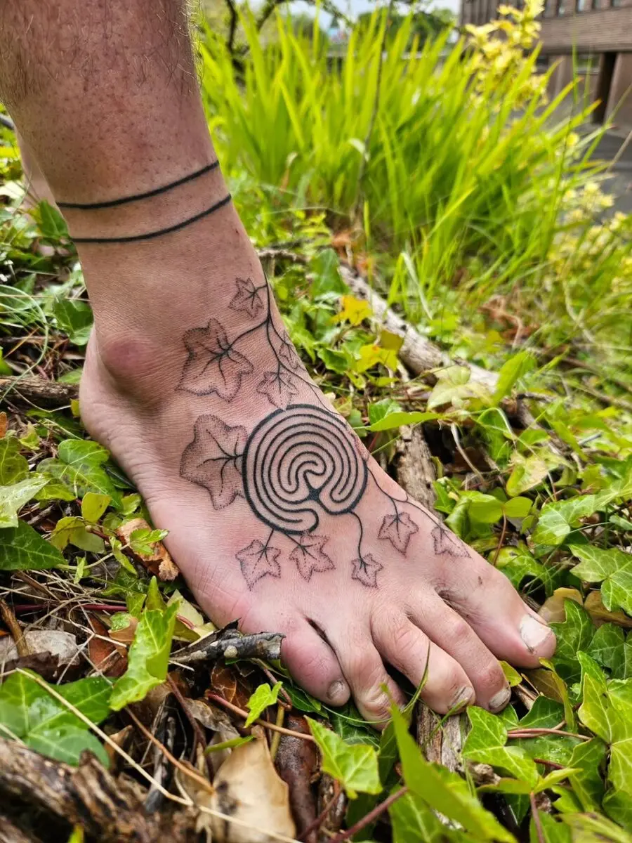 A stunning labyrinth tattoo with ivy vibes