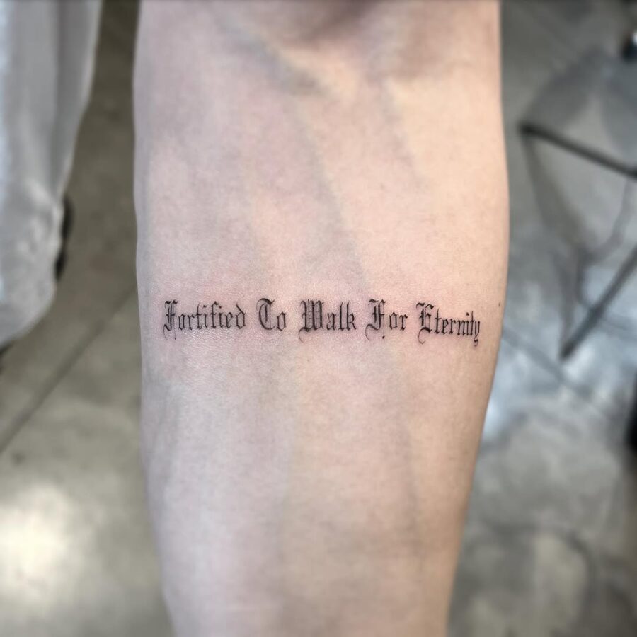 Elegant script tattoo with a profound message