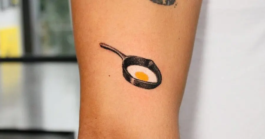 Minimalist Egg Tattoo in a Frying Pan