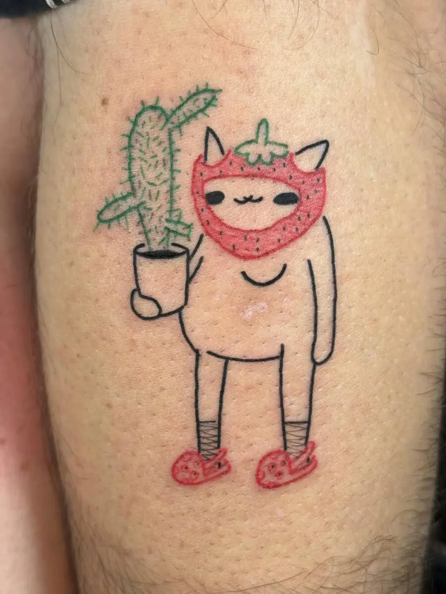 Playful tattoo of a cactus character