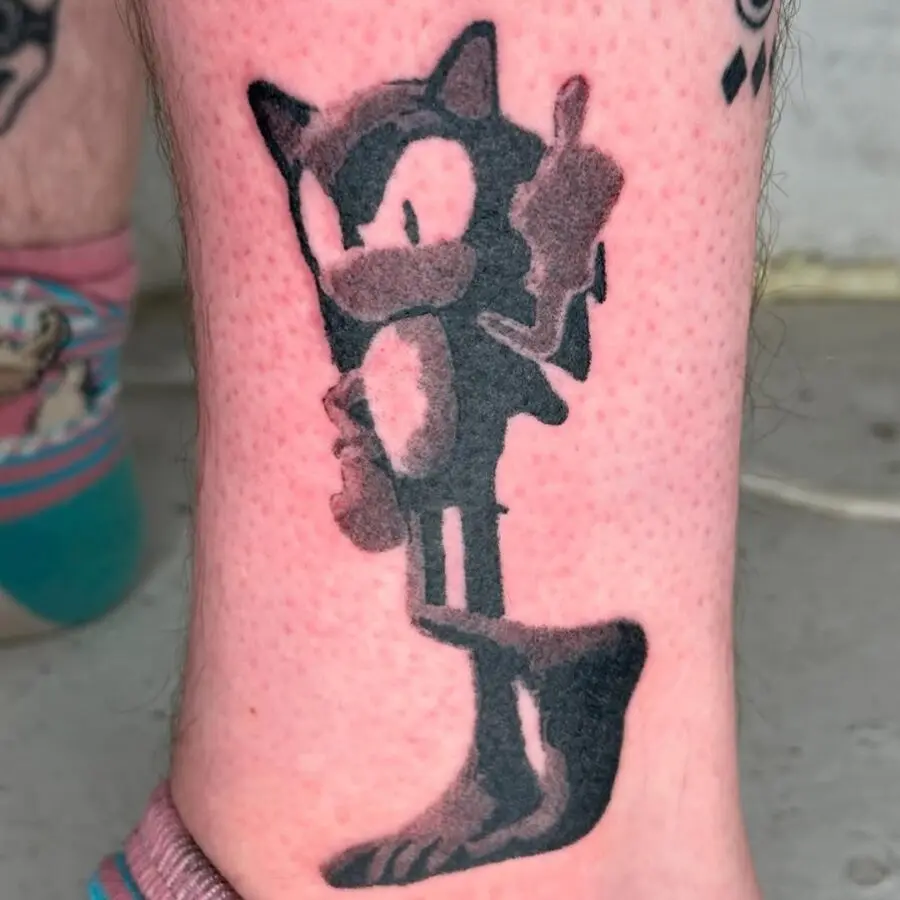 Playful feline tattoo with a cheeky attitude