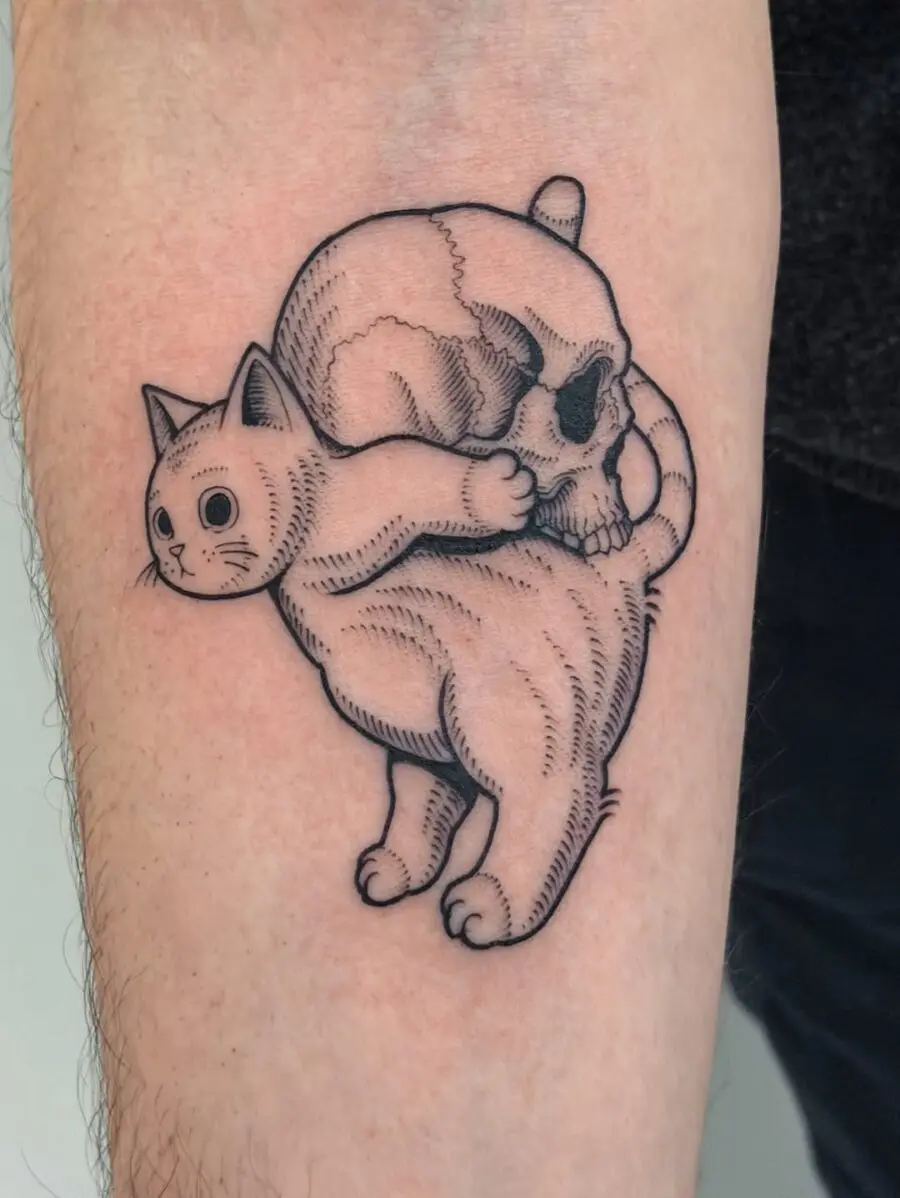 Playful feline meets spooky skull tattoo
