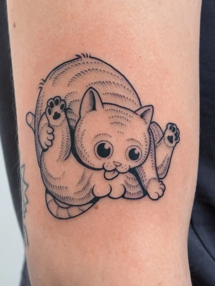 Whimsical cat tattoo that brings smiles