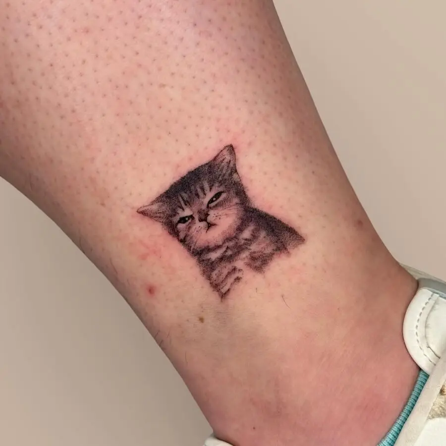 Smug cat tattoo that sparks joy