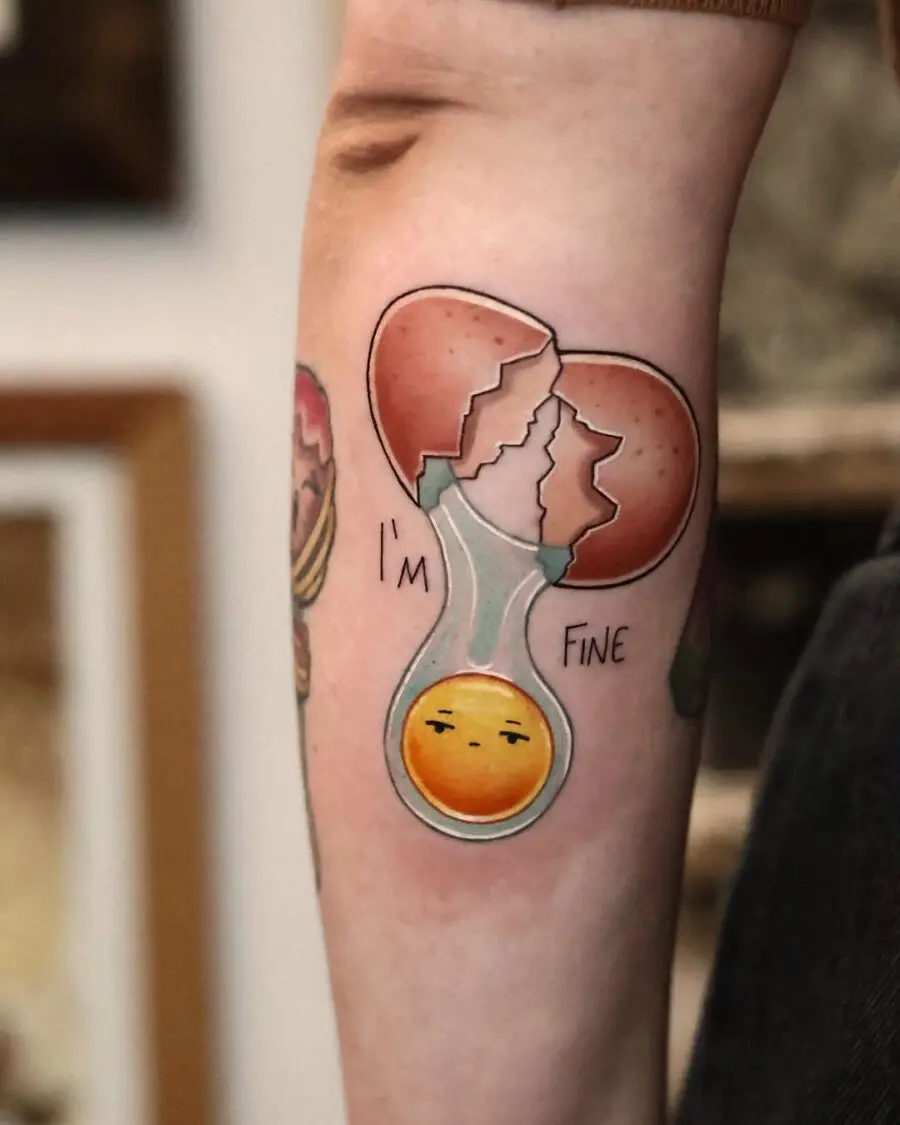 Cracked Egg Tattoo with Humor and Charm