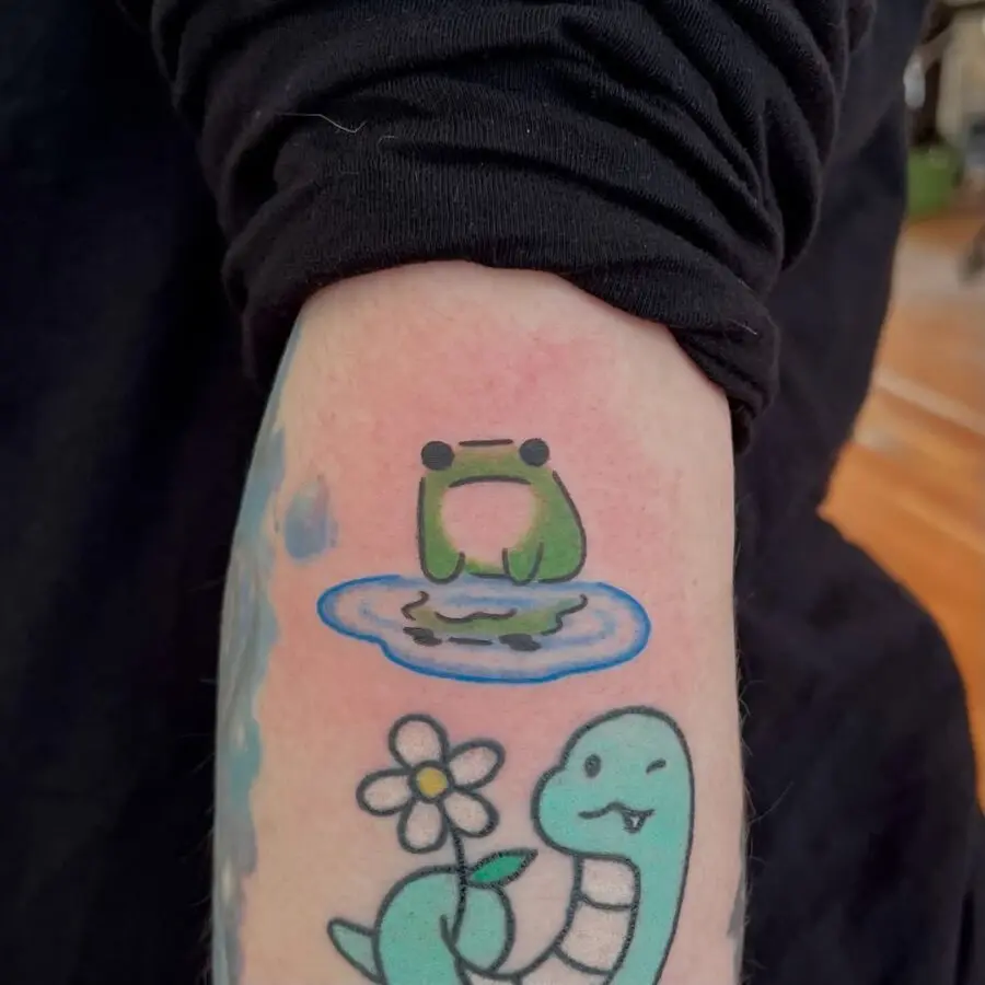 Whimsical frog on a lily pad tattoo