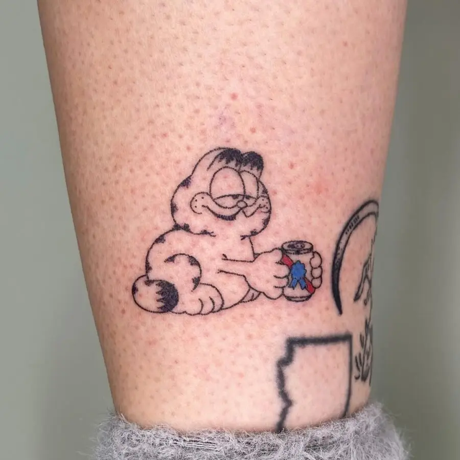 Garfield relaxing with a can of soda