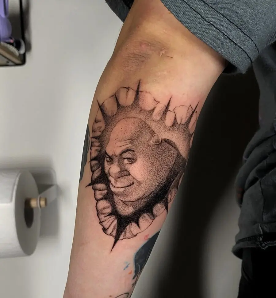 Shrek tattoo bursting through skin design