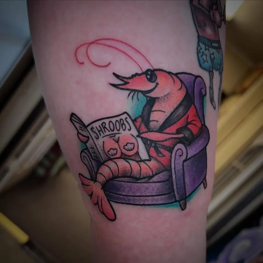 Humorous shrimp tattoo enjoying comic books