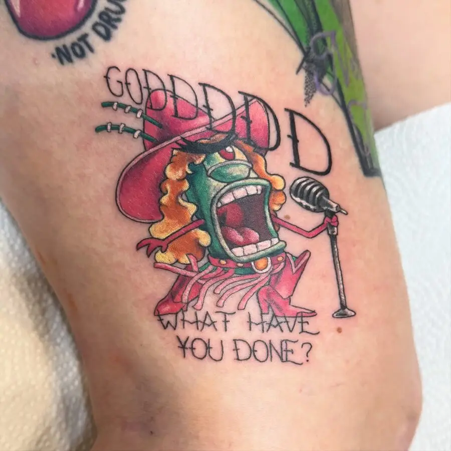 A comical monster tattoo with a microphone