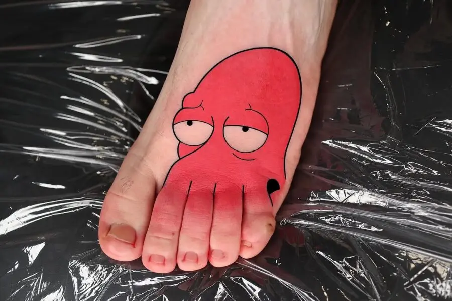 A playful octopus tattoo on a foot.