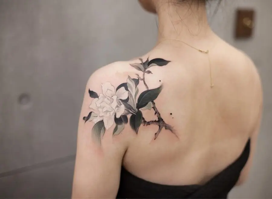 Elegant gardenia tattoo on a shoulder