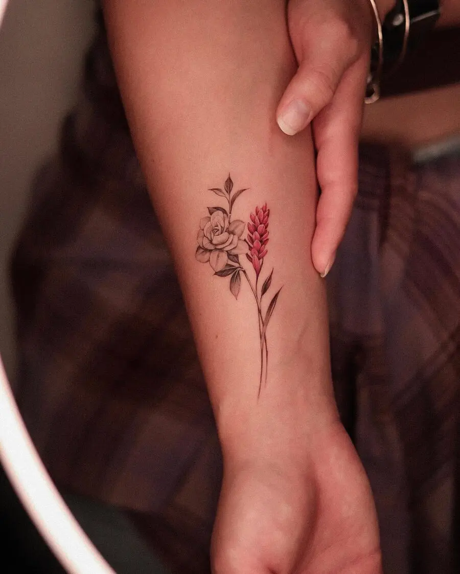 Elegant gardenia and floral tattoo on arm