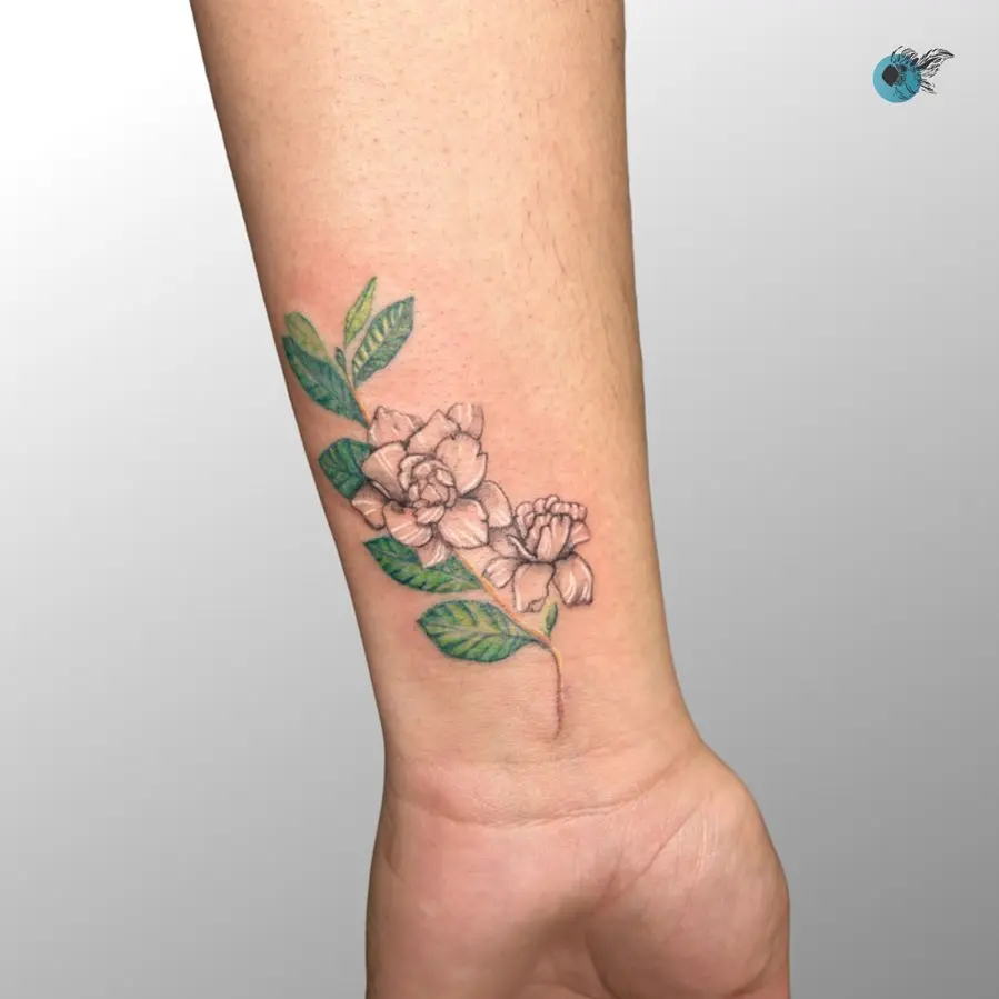 Elegant gardenia tattoo with lush greenery