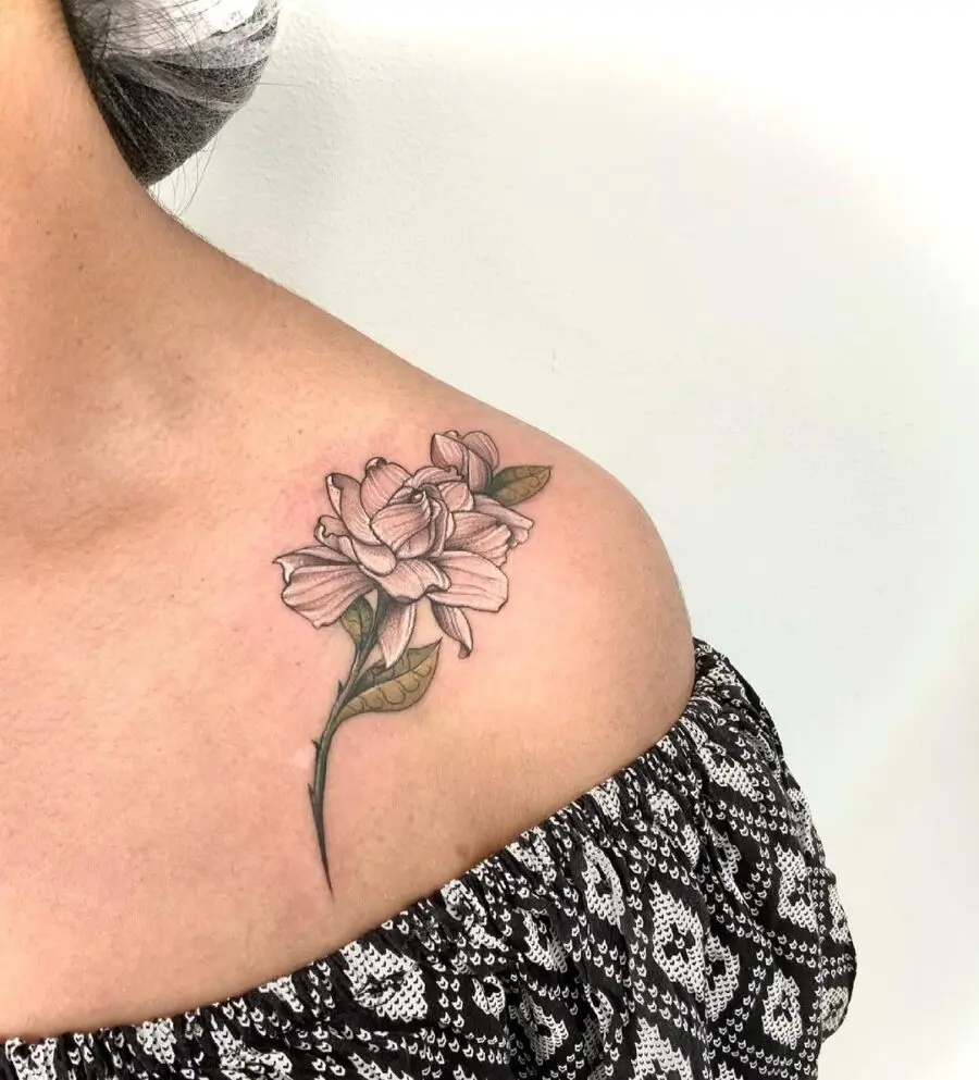 Elegant gardenia tattoo on a shoulder blade.