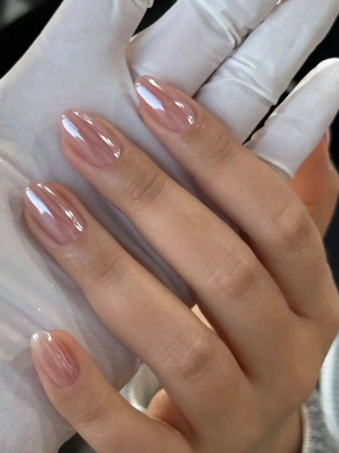 Elegant glazed donut nail art in soft hues