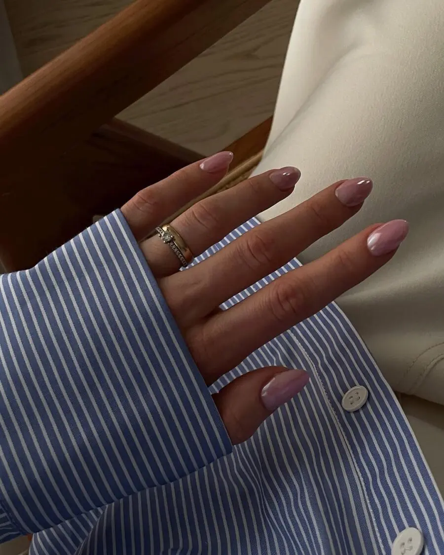 Elegant pink glazed donut nails in focus