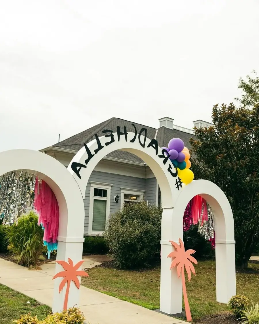 Colorful graduation arch with tropical vibes