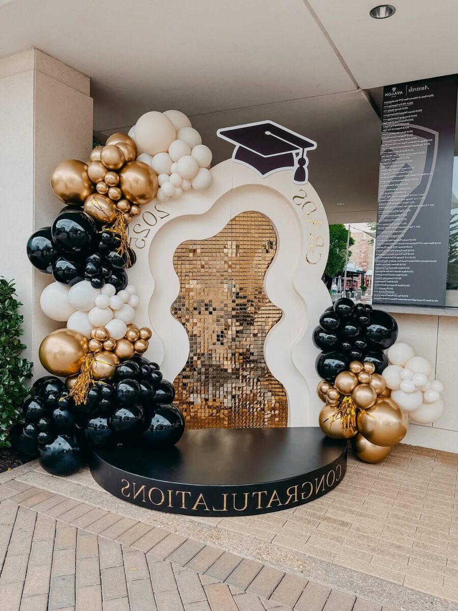 Stylish graduation arch with balloons and sparkles