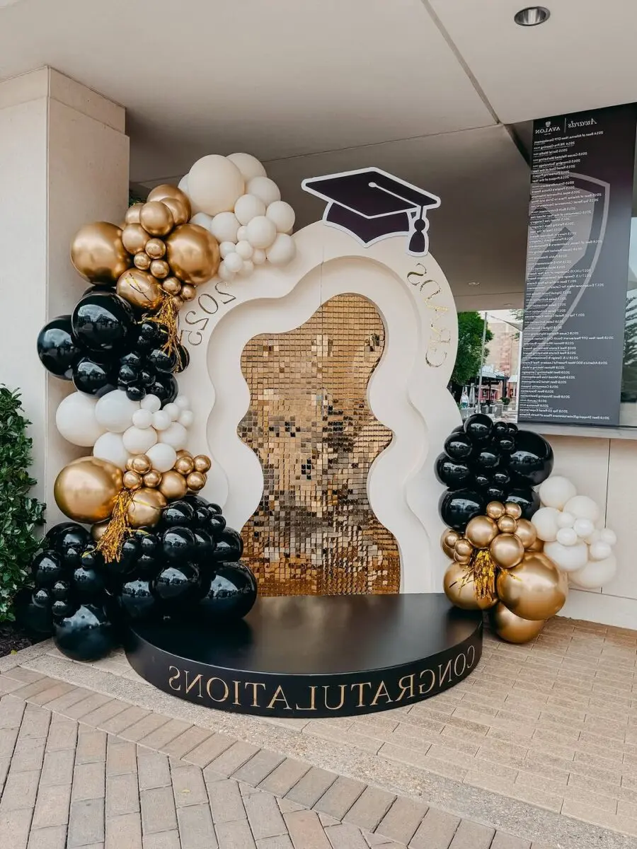 Stylish graduation arch with balloons and sparkles