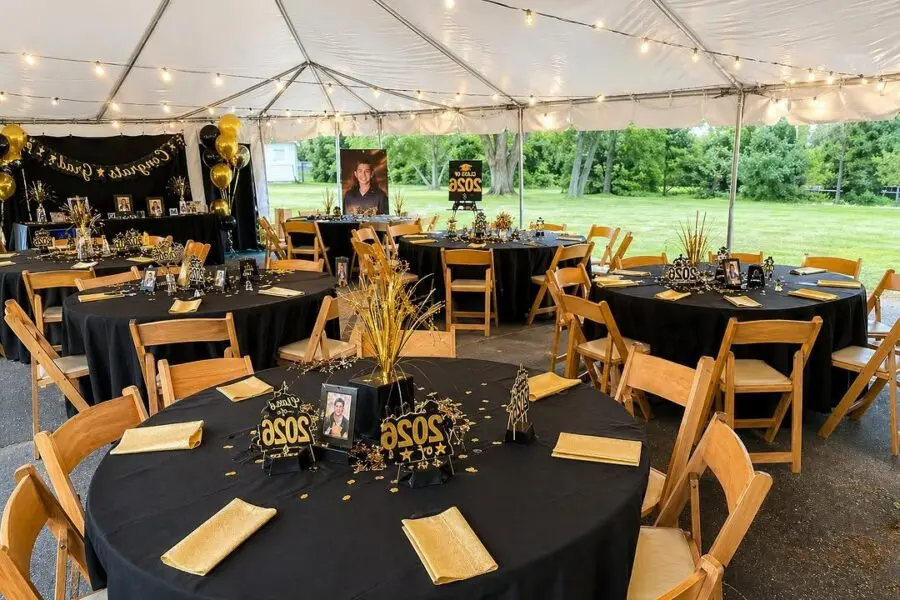 Elegant black and gold graduation celebration setup