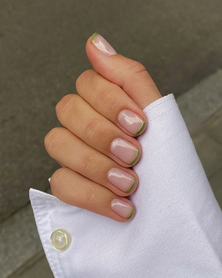 Chic green French tip nail design for summer.